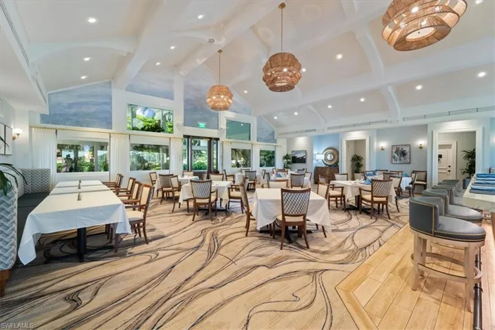 Lobby featuring high vaulted ceiling, beam ceiling, and recessed lighting