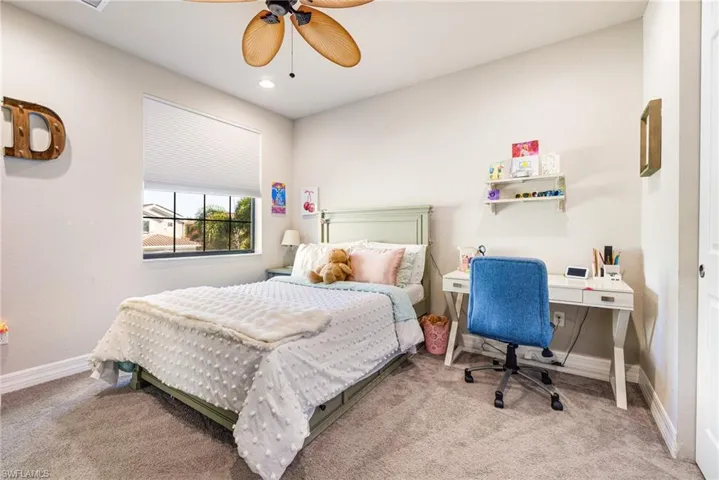 Living room with recessed lighting, visible vents, light wood-style flooring, and ceiling fan with notable chandelier