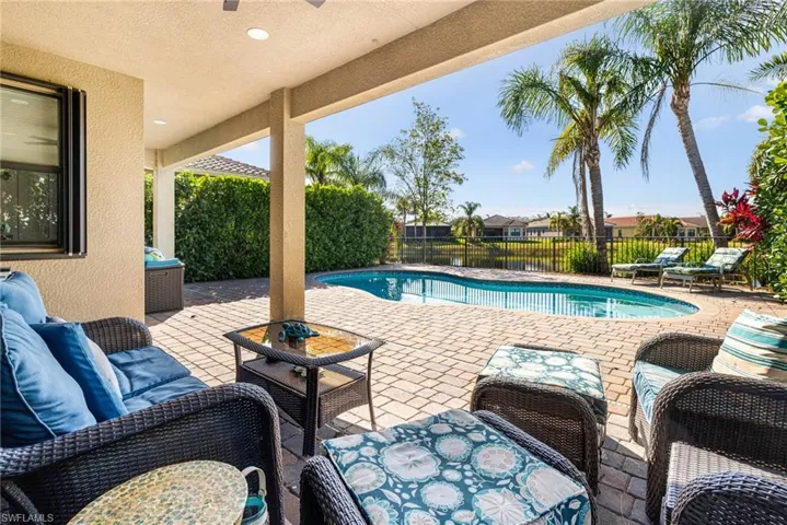 View of swimming pool with a fenced in pool, a patio area, and outdoor lounge area