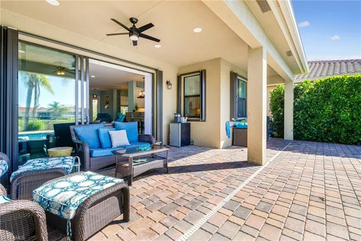 View of patio with a ceiling fan and outdoor lounge area