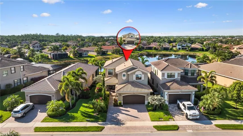 Drone / aerial view with a residential view and a water view