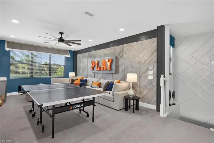 Recessed lighting, ceiling fan, and wall-mounted decorative paneling