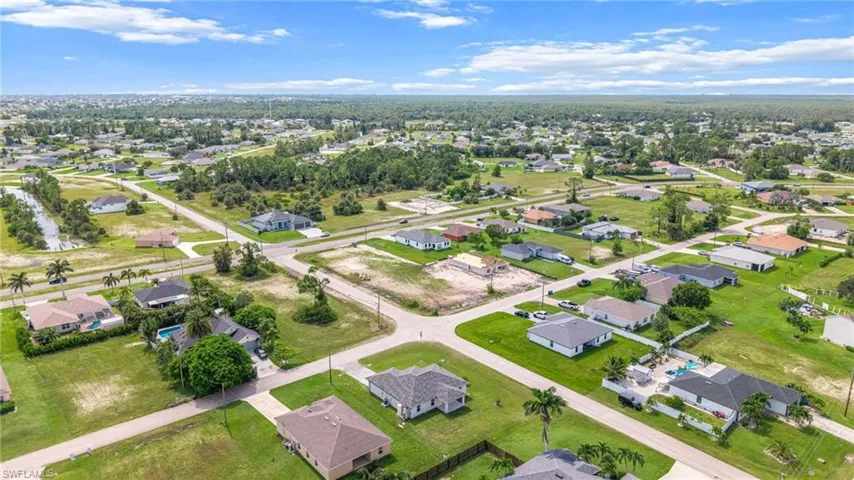 View of property location with nearby suburban area