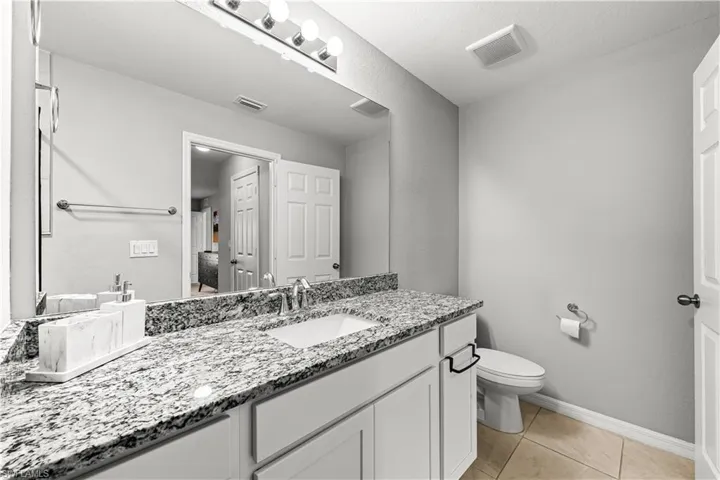 Bathroom featuring vanity and light tile patterned floors
