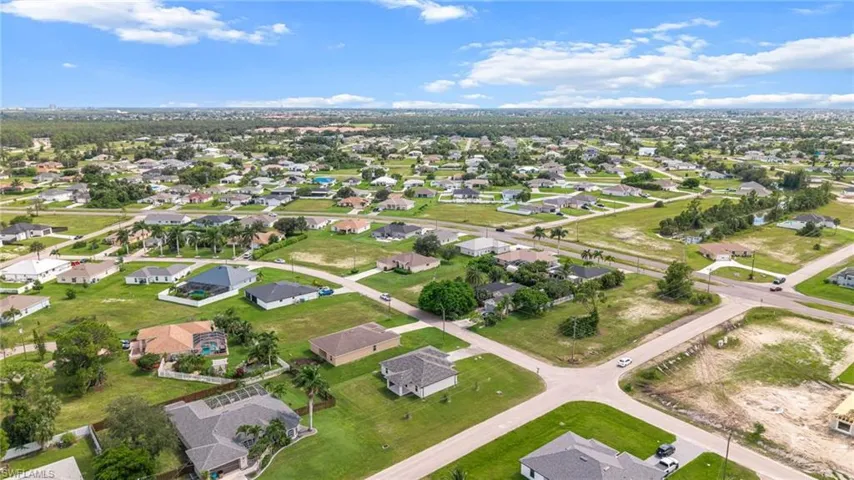 Aerial overview of property's location featuring nearby suburban area