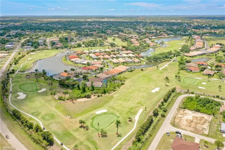 Bird's eye view featuring a residential view, golf course view, and a water view