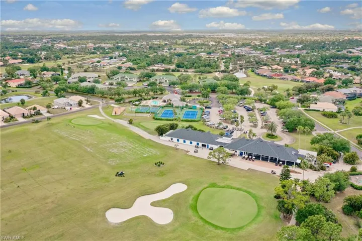 Drone / aerial view with view of golf course and a residential view