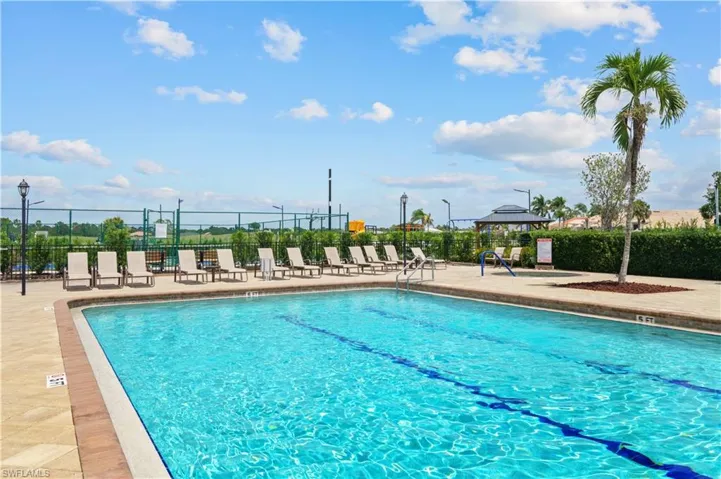 View of swimming pool featuring a gazebo, fence, and a patio area