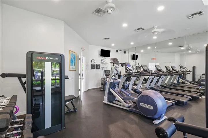 Workout area featuring ceiling fan, visible vents, and recessed lighting