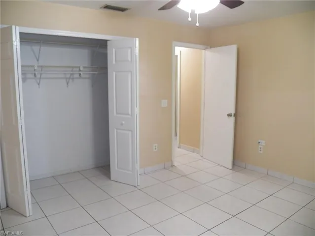 Primary bedroom with double door closet