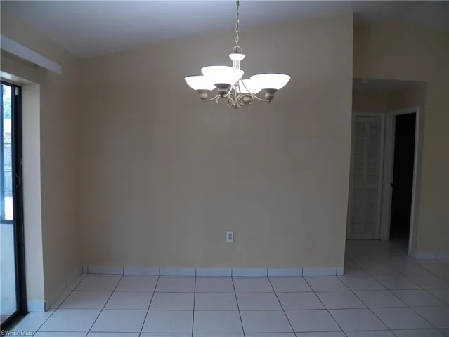 Dining area with sliders to the Florida room