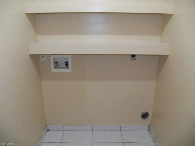 Laundry room between the garage and kitchen