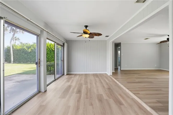 Spare room featuring light wood-style flooring and ceiling fan
