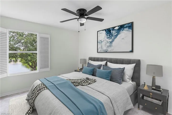 Bedroom with carpet and a ceiling fan