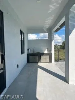 View of patio with area for grilling