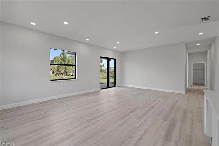 Spare room featuring recessed lighting and light wood-style flooring