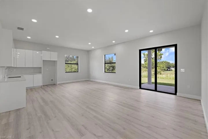 Unfurnished living room featuring recessed lighting and light wood-style flooring