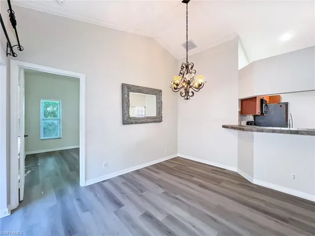 Living area looking into primary bedroom