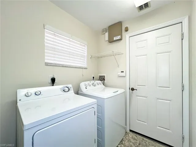 Laundry area with separate washer and dryer
