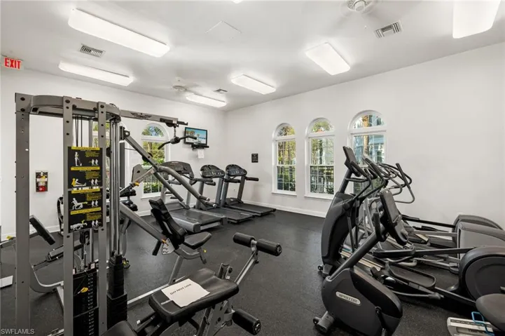 Exercise room featuring a ceiling fan