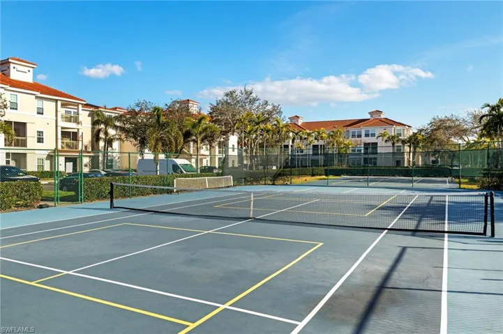 View of tennis court featuring community basketball court