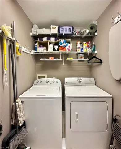 Clothes washing area with washer and clothes dryer