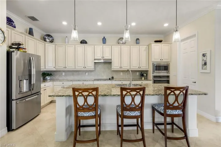 Spacious Kitchen with stainless appliances and electric cooktop.
