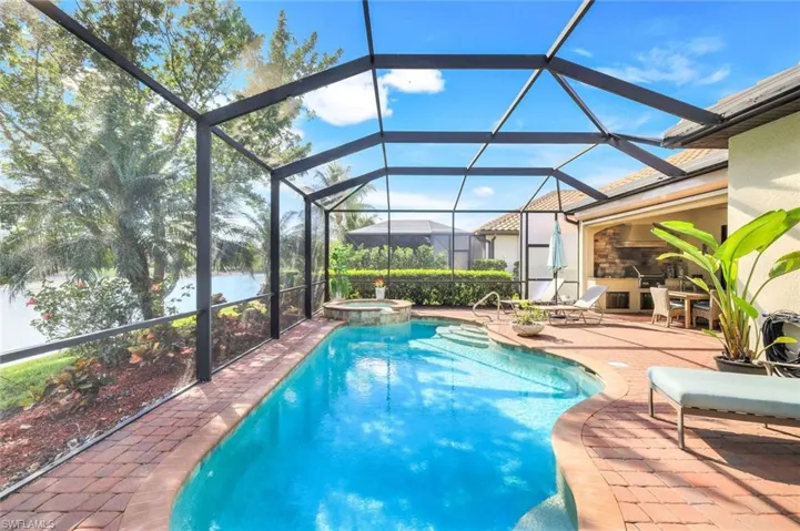 Full view of pool with hot tub and fabulous view.