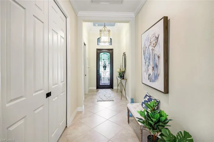 Interior Foyer with updated Chandelier and Crown Molding