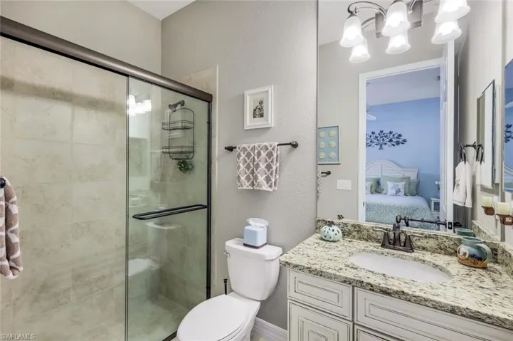Ensuite bathroom shower with glass door.