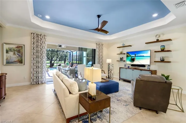 Living area has floating shelves and View of Outdoors