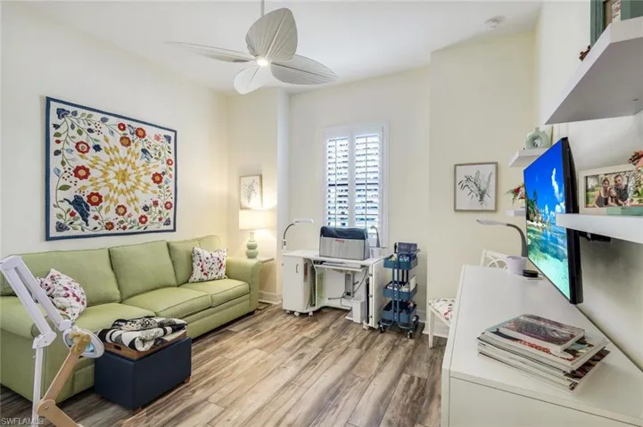 Front bedroom with laminate flooring.