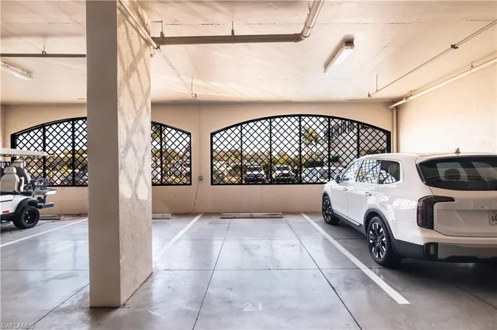 Garage featuring a parking garage