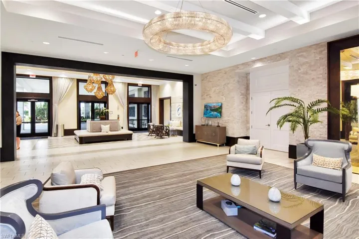 Building lobby with recessed lighting and a raised ceiling