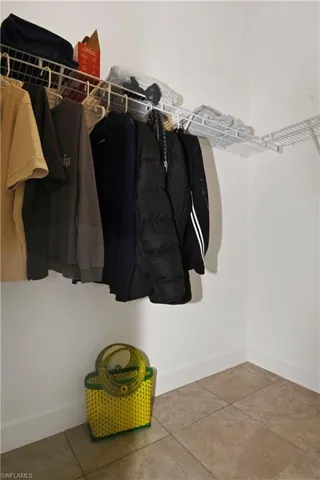Walk in closet featuring tile patterned floors