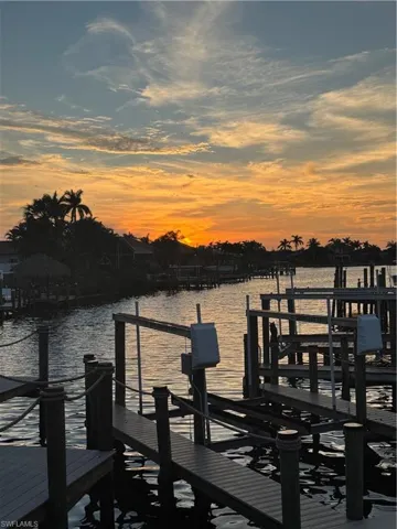 Dock area featuring a water view