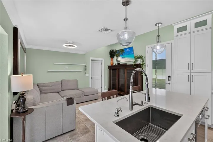 Kitchen island with undermount sink and gooseneck faucet