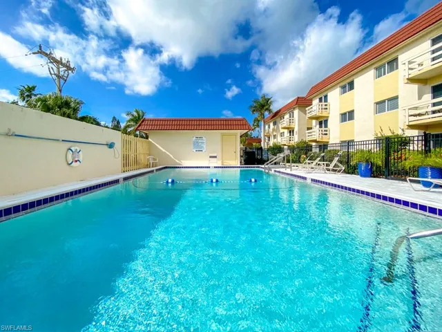 Community pool with a patio area