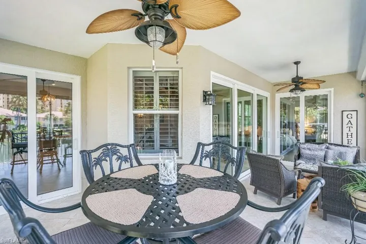 Sunroom / solarium featuring ceiling fan
