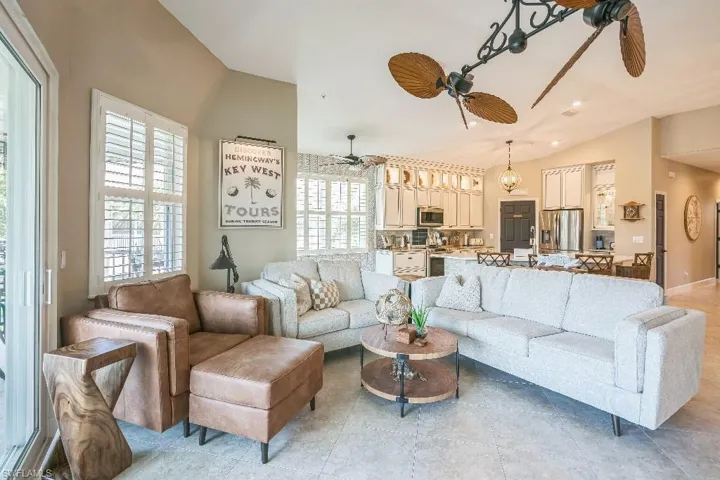 Living room with vaulted ceiling and ceiling fan