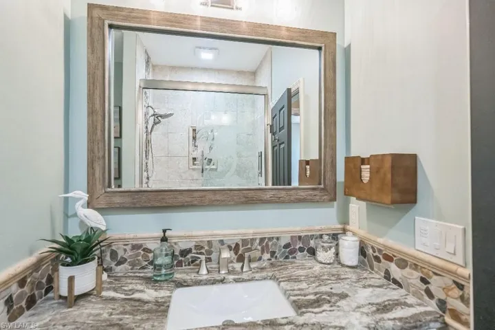 Bathroom with vanity and an enclosed shower
