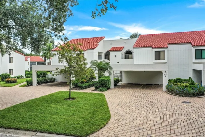 Mediterranean / spanish home featuring a front lawn