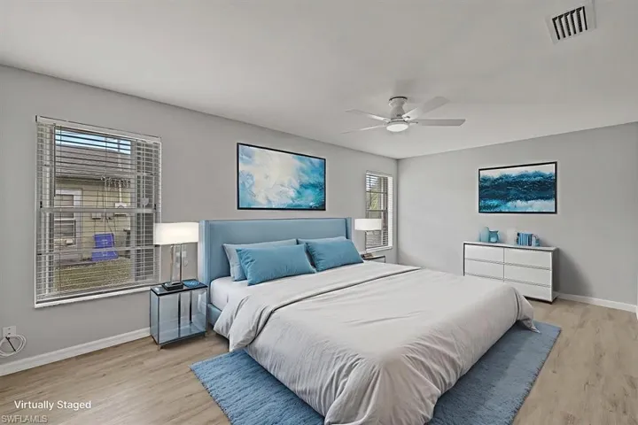 Bedroom featuring light wood-style flooring and ceiling fan