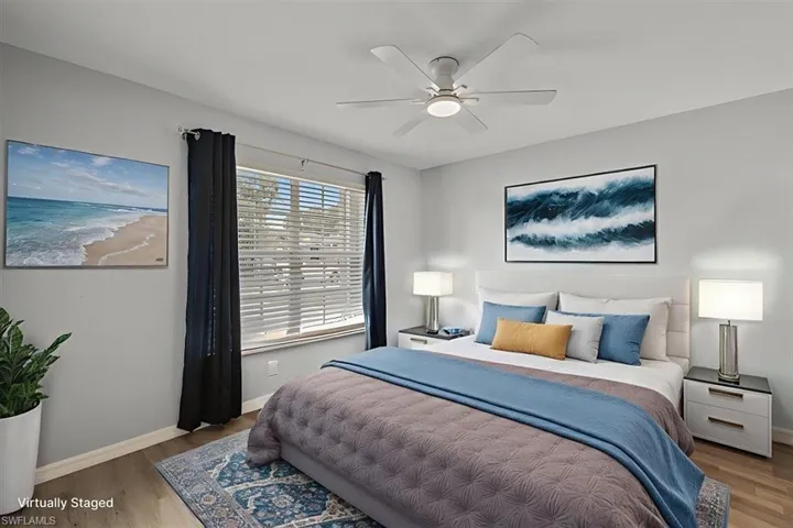 Bedroom with wood finished floors and a ceiling fan