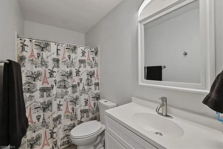 Bathroom with vanity and a shower with curtain