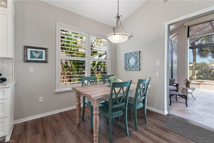 Dining space featuring lofted ceiling and a healthy amount of sunlight