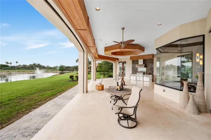 Oversized covered patio with electric screens & shutters