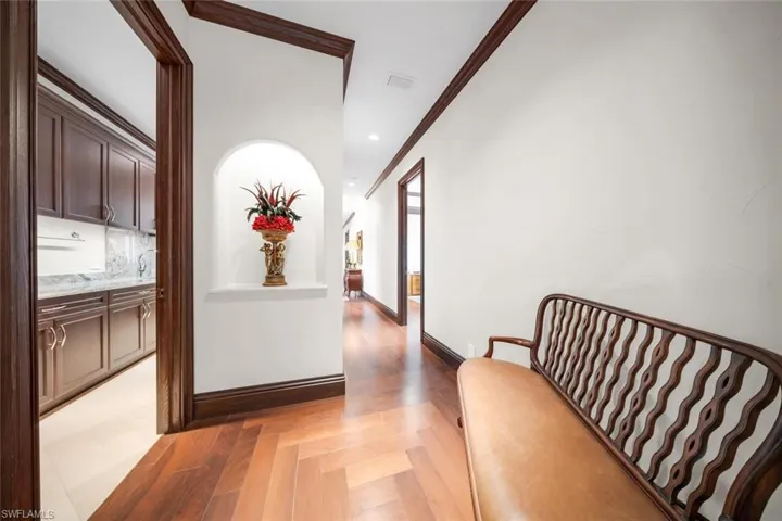 Hallway to additional bedrooms, game area & more