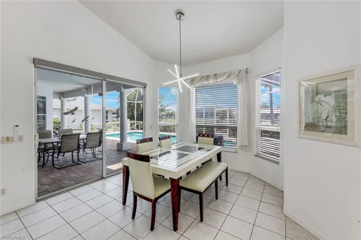 Interior space featuring vaulted ceilings and tile flooring