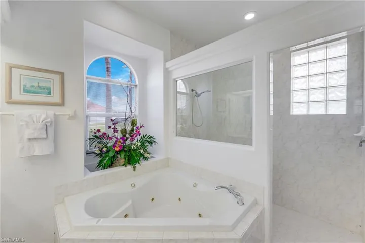 Soaking tub with integrated jets and tiled surround